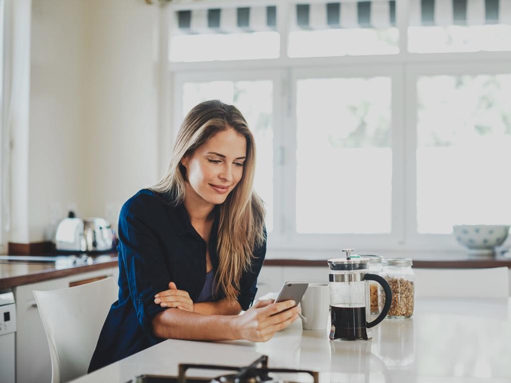 Woman20with20phone20and20coffee